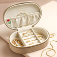 Embroidered Flowers Oval Jewellery Box Open and Filled with Jewellery