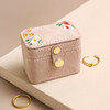 Embroidered Flowers Petite Travel Ring Box on Beige Surface