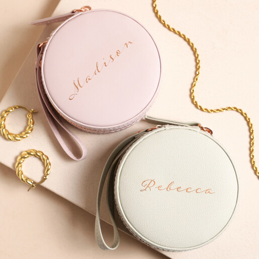 Personalised Rose Gold Script Name Mini Round Travel Jewellery Case on Pink Surface Surrounded by Jewellery