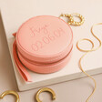 Personalised Mini Round Travel Jewellery Case in pink on neutral coloured background