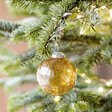Amber Glass Bauble hanging on Christmas Tree