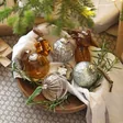 Amber Glass Bauble in Bowl with Other Baubles