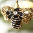 Close up of Bee Beaded Hanging Decoration hanging from tree