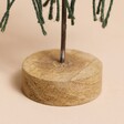 Close up of Wooden Base of Green Woven Rope Tree Ornament