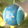 Side of Hand-Painted Winter Moon Bauble hanging in Christmas tree
