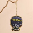 Norfolk Snow Globe Beaded Hanging Decoration Hanging Against Pink Background