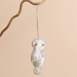 Owl Beaded Hanging Decoration on tree branch against neutral background