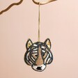 Tiger Beaded Hanging Decoration Hanging Against Beige Surface