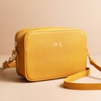 Personalised Rectangular Crossbody Bag in mustard on top of beige coloured backdrop