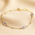 Lilac Enamel Evil Eye Anklet in Gold on Beige Fabric