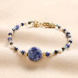 Blue Crystal and Stone Beaded Bracelet on Beige Fabric