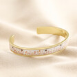 Pink Floral Bee Enamel Bangle in Gold on top of beige coloured fabric