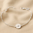 Silver Personalised Initial Disc and Figaro Chain Bracelet on Neutral Fabric