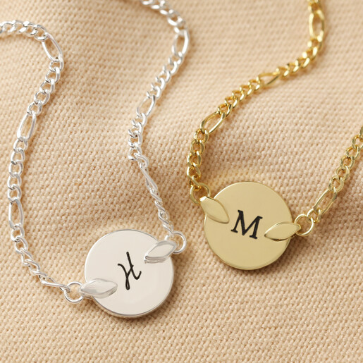 Personalised Initial Disc and Figaro Chain Bracelet on Neutral Fabric