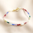 Rainbow Semi-Precious Beads and Freshwater Pearl Bracelet on neutral coloured fabric