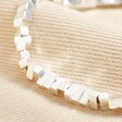 Close up of beads on Rectangular Beaded Bracelet in Silver against neutral material