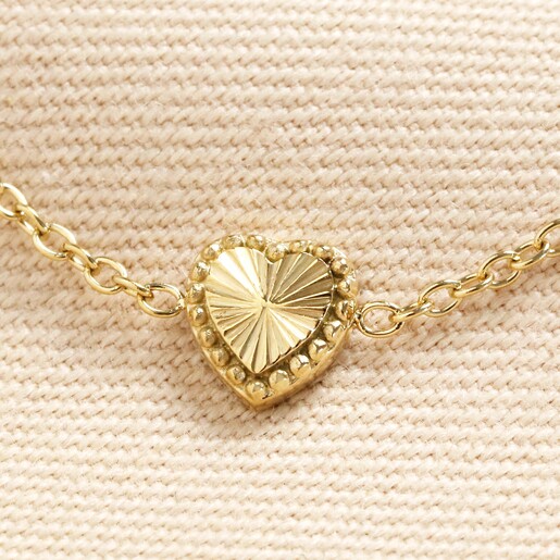 Stainless Steel Tiny Gold Heart Bracelet in Gold Close up of Charm on Stainless Steel Tiny Gold Heart Bracelet in Gold