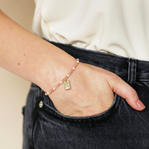 Talisman Charm Pink and Pearl Beaded Bracelet in Gold on Model with Hand in Pocket
