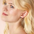 Blue Crystal Sunburst and Chain Stud Earrings in Gold on Model's Ear