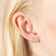 Moon Earring from Set of Four Crystal Celestial Stud Earrings in Gold on blonde model