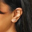 Close up of Set of Four Crystal Celestial Stud Earrings in Silver on model