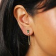 Close Up of Model Wearing Green and Pink Crystal Chain Stud Earrings in Gold 