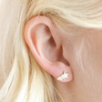 Close up of Mother of Pearl Shooting Star Stud Earrings in Gold on model