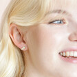 Model laughing wearing Mother of Pearl Shooting Star Stud Earrings in Gold