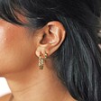 Set of 2 Green Crystal Huggie and Hoop Earrings in Gold on model