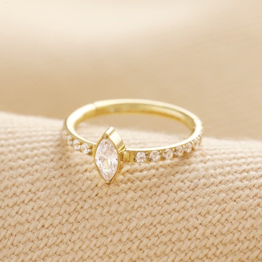 Titanium Marquise Crystal Huggie Hoop Earring in Gold on Beige Fabric