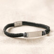 Men's Leather Fishtail Bracelet in Grey on top of beige coloured fabric