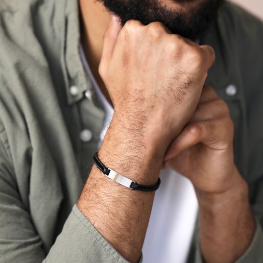 Men's Leather Fishtail Bracelet in Black on model with hand on bracelet