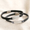 Men's Leather Fishtail Bracelet in Black with grey version on top of beige coloured fabric