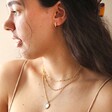 Crystal Edge Disc Pendant Necklace in Gold on Model with other necklaces