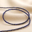 Delicate Blue Stone Beaded Necklace on Beige Fabric