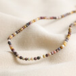 Delicate Brown Stone Beaded Necklace on beige material