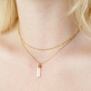 Close Up of Model Wearing Double Chain and Rose Quartz Point Necklace in Gold