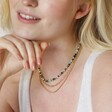 Semi-Precious Stone Bead Necklace in Blue and Green on model in curated look with hand on chin