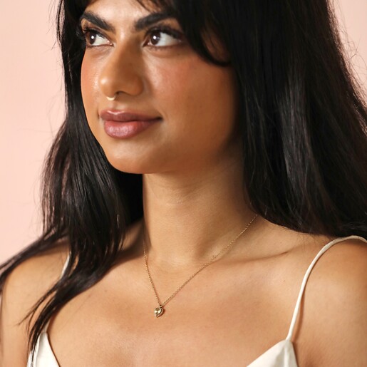 Stainless Steel Tiny Heart Pendant Necklace in Gold on Model