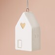 Close Up of Ceramic House Hanging Decoration