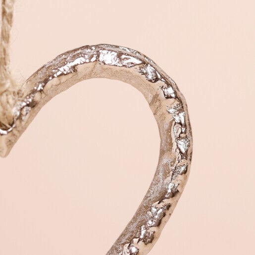 Close Up of Detail on Textured Silver Heart Hanging Decoration