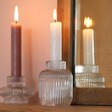 Two in One Medium Fluted Glass Candle Holder with candlestick inside next to small fluted vase