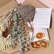 Contents inside of Gingerbread Christmas Wreath Making Kit packaging