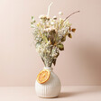 Gingerbread Dried Flower Posy Against Beige Background