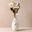 Merry Christmas Dried Flower Posy Letterbox Gift on Beige Surface 