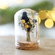 Blue and yellow Mini Christmas Dried Flower Glass Dome against Christmas tree background