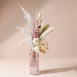 Winter Solstice Dried Flower Posy with Vase on Neutral Background