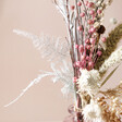 Close Up of Flowers in Winter Solstice Dried Flower Posy with Vase on Neutral Background