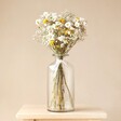 Golden Daisy Dream Dried Flower Bouquet in tall glass vase