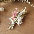 Wildflower Dried Flower Buttonhole on Wooden Surface